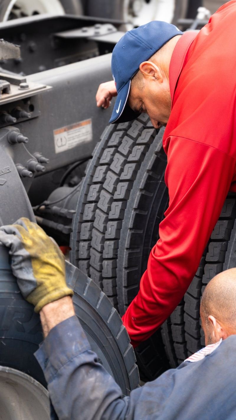 Technician working on truck tires